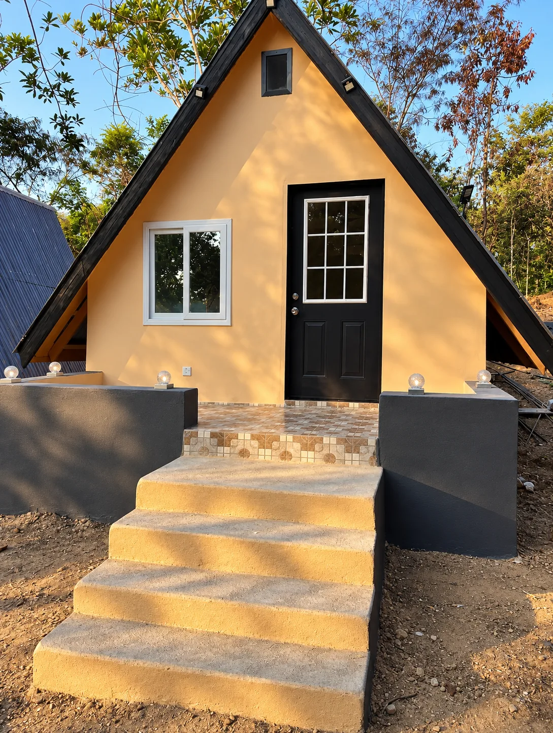 Steps leading to an A-frame cabin