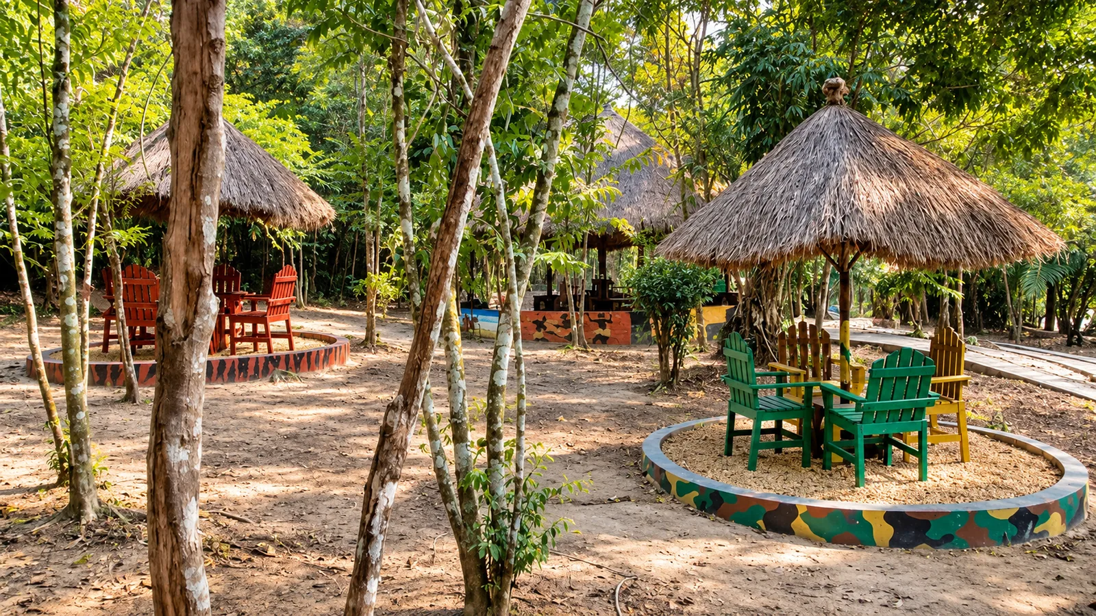 Outdoor tables beneath thatched shelters