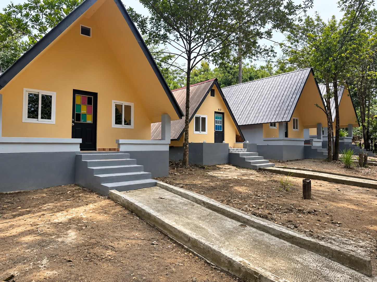 A-frame cabins beside the courtyard at Bush Garden